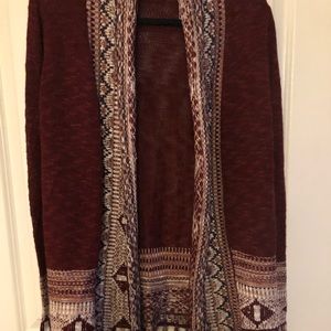 Cute pre owned sweater. Burgundy